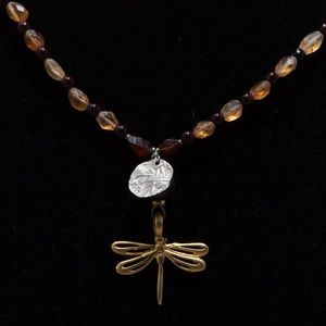 Boho butterfly copper with hammered silver disc and garnet and topaz.